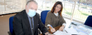 Presidenta de AUDERGO, Mgtr. Stella Conde y el Director Adjunto de UNIT, William Campugiani firmando el convenio.